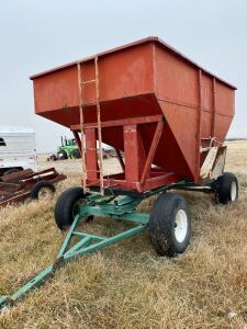*275-bushel Sakundiak gravity box on heavy 4-wheel wagon